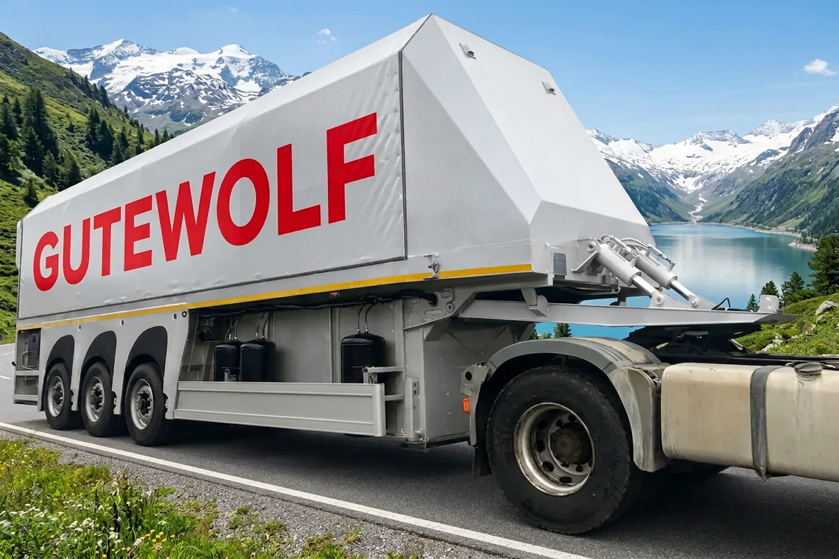 Серебристый полуприцеп стекловоз GuteWolf Пирамида в горах, вид сбоку